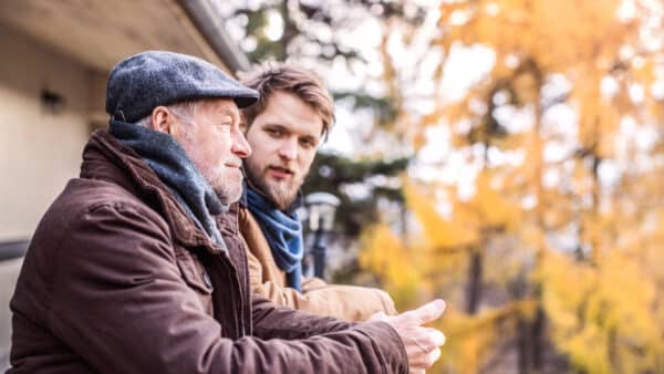 Young Man Talking To A Senior Man | Elder Care Attorney | Myatt & Bell