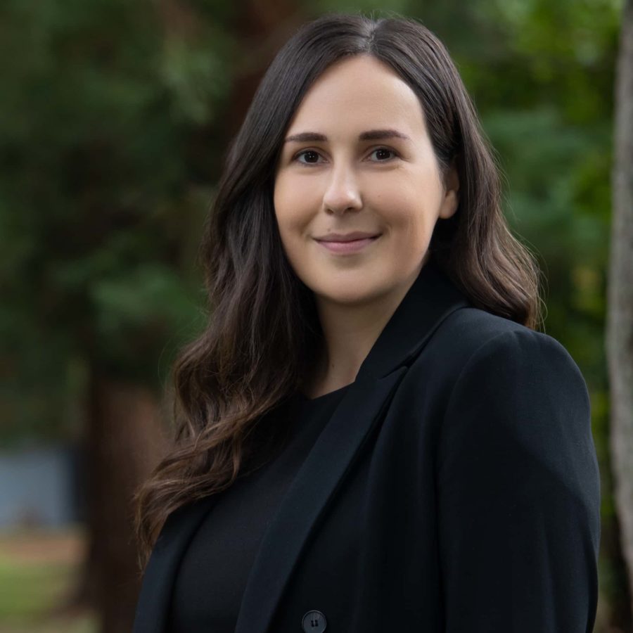 A professional woman wearing a black blazer over a black shirt | Estate Lawyer | Myatt & Bell, P.C.