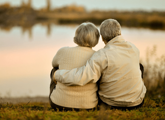 Senior Couple Sitting Near Lake | Elder Care Attorney | Myatt & Bell