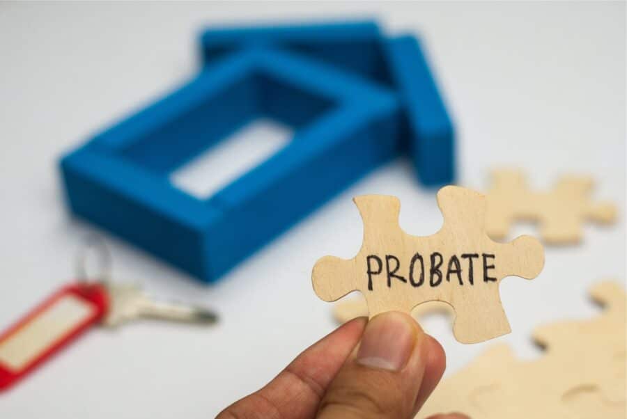 A hand holding a puzzle piece labeled Probate | Probate Process | Myatt & Bell, P.C.
