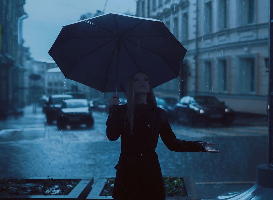Woman Caught In A Rain | Incapacity Planning | Myatt & Bell, P.C.