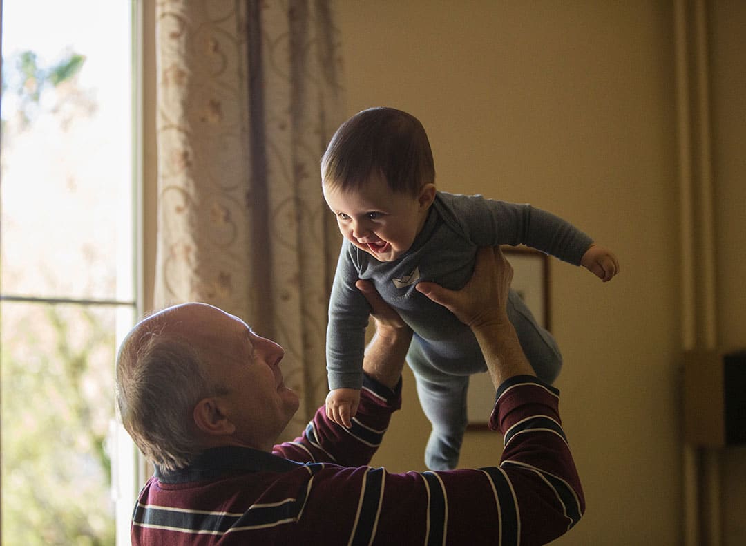 Grandfather Playing With Grandchild | Elder Law Attorney | Myatt & Bell