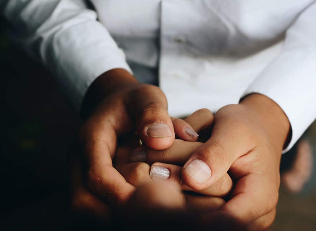 Man Holding Hand Of A Woman | Trust Administration Services | Myatt & Bell, P.C.