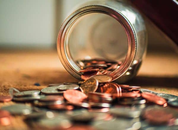 Coins Spilling From A Jar | Estate Lawyer | Myatt & Bell